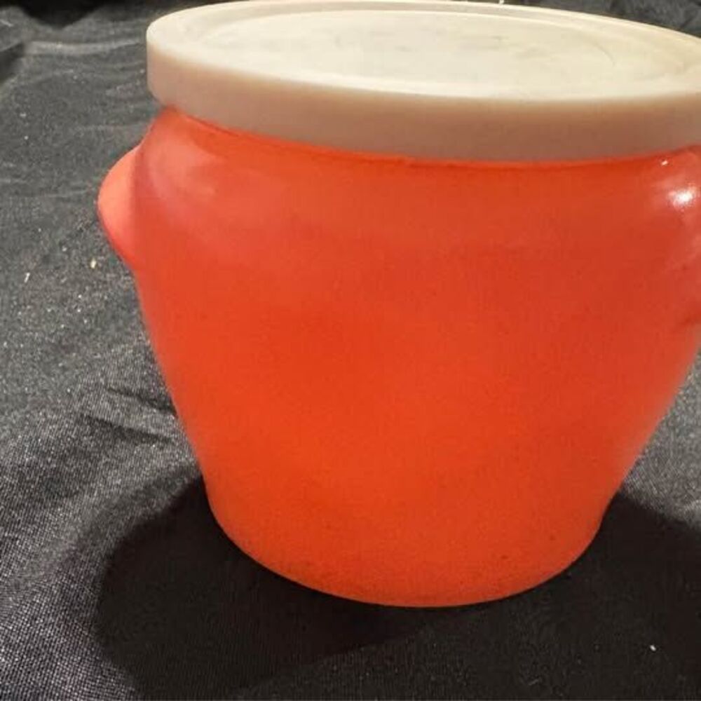 vintage Glasbake Honey Whip jar in a salmon coral pink color. 1950-60 with lid